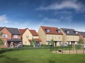 An impression of some of the Keepmoat Homes, overlooking a children's open space.