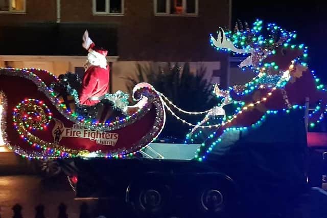 Lincolnshire firefighters have raised a record-breaking amount for charity with their Santa's sleigh tours of the county's towns and villages. Photo: LCC EMN-220224-121055001