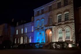 The NKDC offices were lit in blue and yellow in support of Ukraine on Thursday evening.