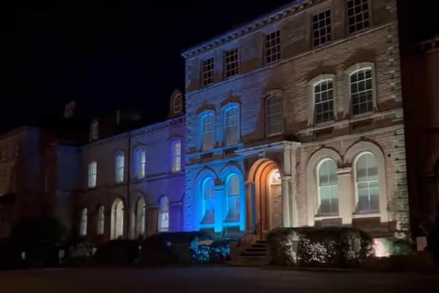 The NKDC offices were lit in blue and yellow in support of Ukraine on Thursday evening.