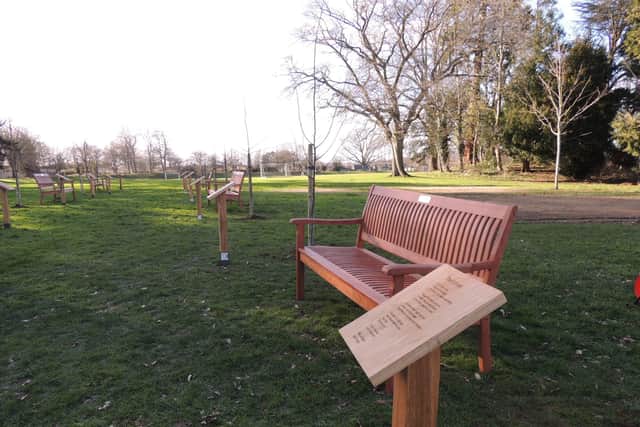 Oak plaques bear poems and benches carry inspirational phrases in St George's Academy Avenue of Remembrance to the coronavirus pandemic. EMN-220226-115753001