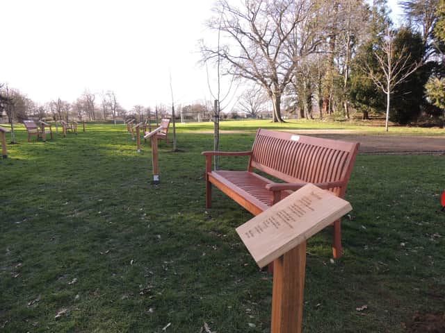Oak plaques bear poems and benches carry inspirational phrases in St George's Academy Avenue of Remembrance to the coronavirus pandemic. EMN-220226-115753001