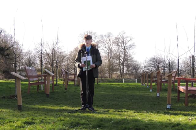 Another poet reads his lines at the ceremony at St George's Academy. EMN-220226-115806001