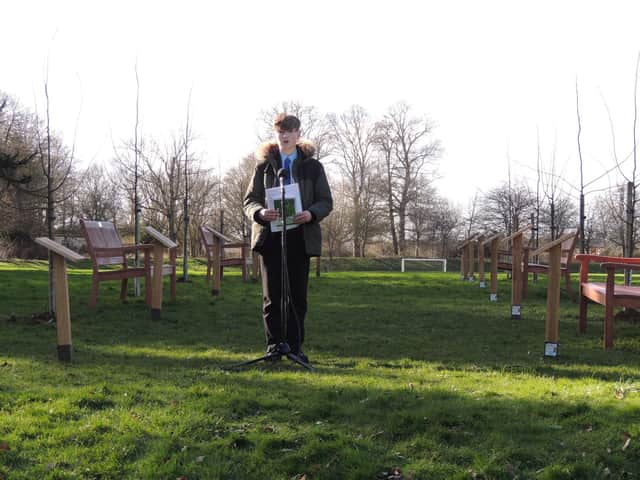 Another poet reads his lines at the ceremony at St George's Academy. EMN-220226-115806001