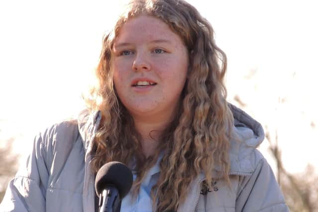 One of the poetry competition winners reads her words at the ceremony. EMN-220226-115816001