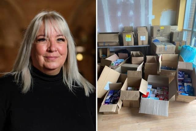 Patsie Marson, of Community Support Group, with half of the donations that have been received so far at their temporary collection unit at Boston Shopping Park.