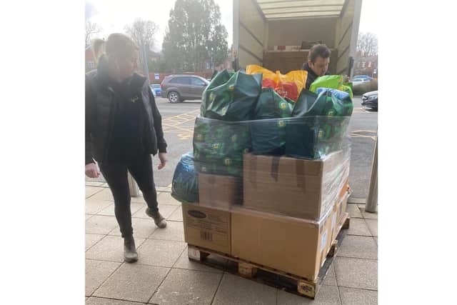 One of the pallets being loaded into a van.