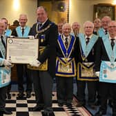 Lincolnshire’s Provincial Grand Master Dave Wheeler presents Skegness St Clement Lodge members with the Centenary Warrant.