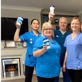 Team members at Avocet House with the reusable coffee cups