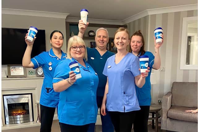 Team members at Avocet House with the reusable coffee cups