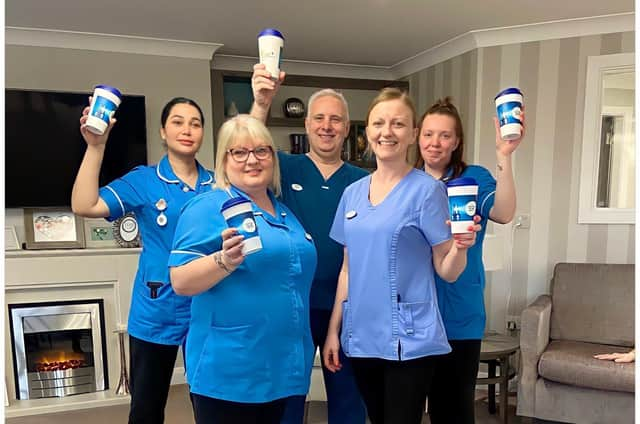 Team members at Avocet House with the reusable coffee cups