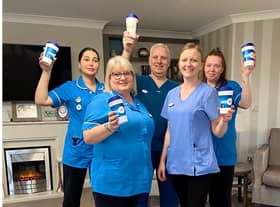 Team members at Avocet House with the reusable coffee cups