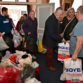 People pour into Sleaford Masonic Rooms with bags of donations for the Ukraine appeal. Photo: David Dawson