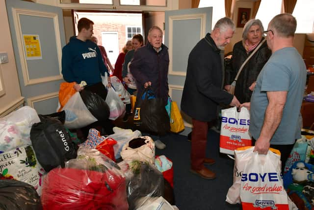 People pour into Sleaford Masonic Rooms with bags of donations for the Ukraine appeal. Photo: David Dawson