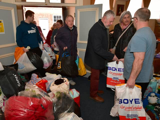 People pour into Sleaford Masonic Rooms with bags of donations for the Ukraine appeal. Photo: David Dawson