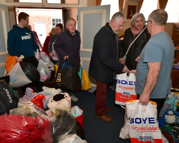 People pour into Sleaford Masonic Rooms with bags of donations for the Ukraine appeal. Photo: David Dawson