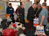 People pour into Sleaford Masonic Rooms with bags of donations for the Ukraine appeal. Photo: David Dawson