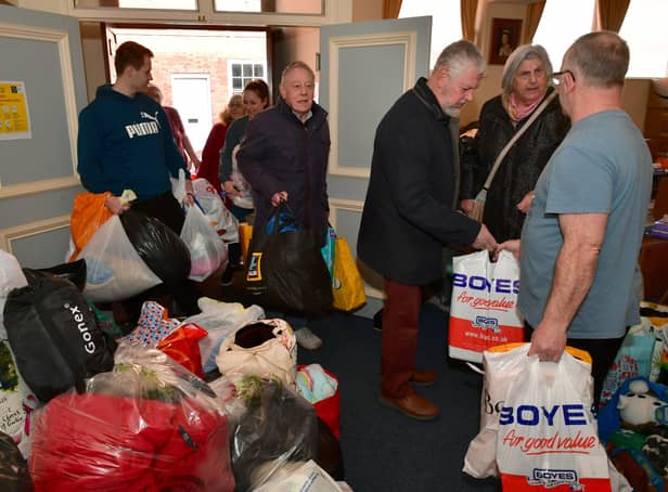 People pour into Sleaford Masonic Rooms with bags of donations for the Ukraine appeal. Photo: David Dawson