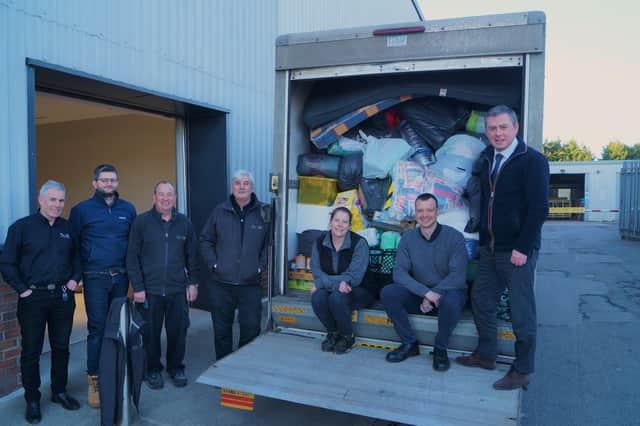 Some of the Duckworths team with the second load of goods being transported on Monday EMN-220703-195303001