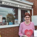 Postmistress Ann Bennett with her award