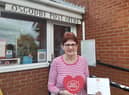 Postmistress Ann Bennett with her award