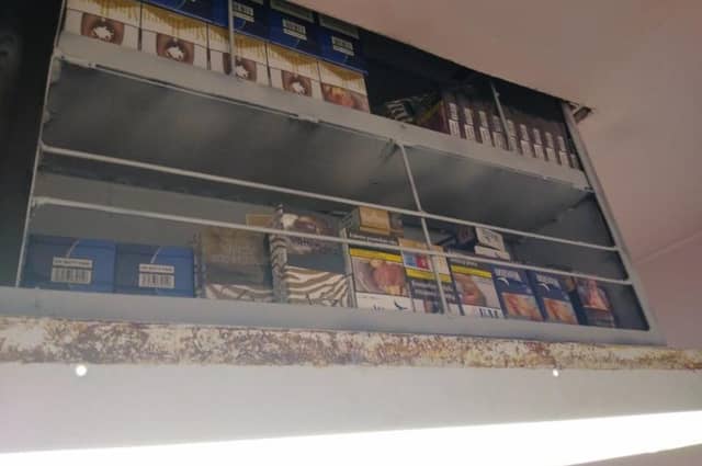 The illegal cigarettes above the ceiling light at the shop in Boston.