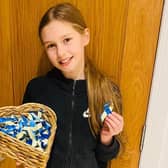 Belle Nicholls, 10, has been making blue and yellow ribbons for the Ukraine Appeal in support of UNICEF and the Red Cross.