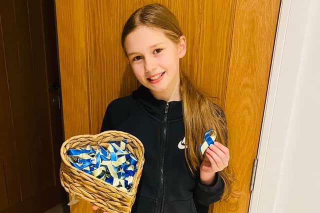 Belle Nicholls, 10, has been making blue and yellow ribbons for the Ukraine Appeal in support of UNICEF and the Red Cross.