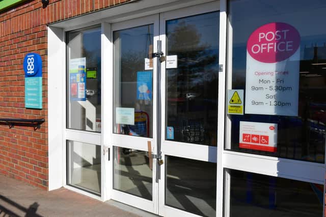 Doors damaged during the cash machine raid at Ruskington Co-op food store. EMN-220314-153910001
