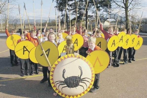 Murray Edwards, aka Archon, centre, visiting Chestnut Street Primary School, in Ruskington, to teach the pupils about Ancient Greece. At the front, Sophie Holmes and Charlie Hare.