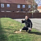 Alex Rutherford-Doak from the Woodland Trust planting trees at the Woolpack Inn, Louth. EMN-220317-101422001