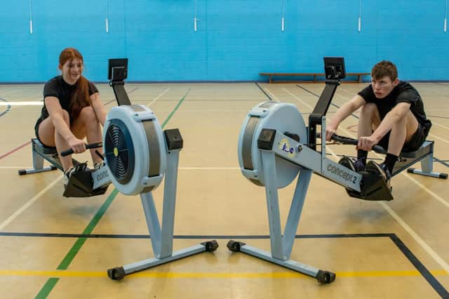 Scarlett Stone and Scott Adlington are celebrating after winning gold in a national indoor rowing competition.