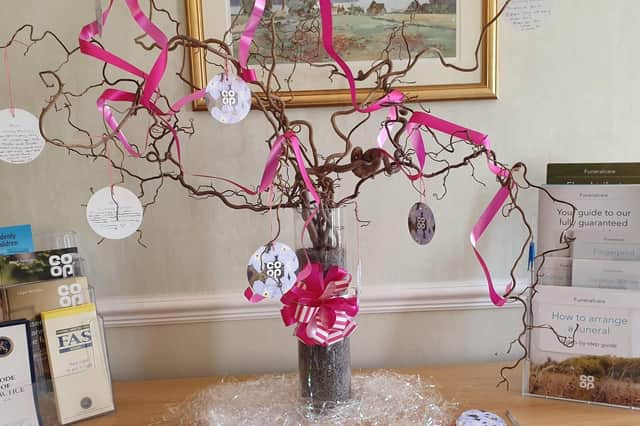 Remember your mum by hanging bauble and sharing memories over a cuppa and cake.