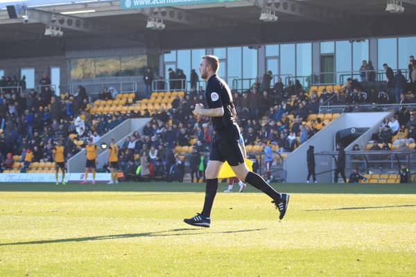Craig Forbes was plucked from the crowd to run the line as Boston United hosted Gateshead. Photo: Oliver Atkin