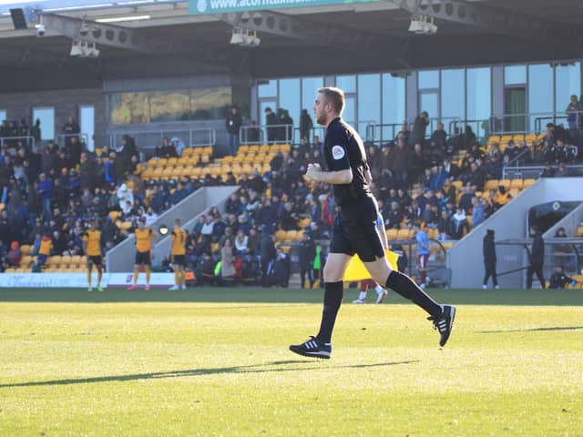 Craig Forbes was plucked from the crowd to run the line as Boston United hosted Gateshead. Photo: Oliver Atkin