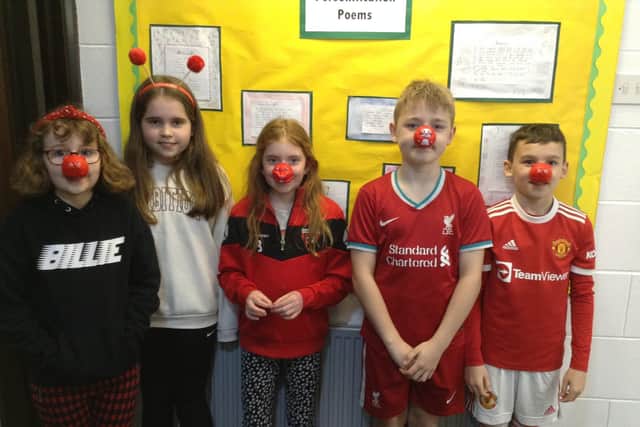 East Wold primary school pupils dress in red for Comic Relief. EMN-220321-104007001