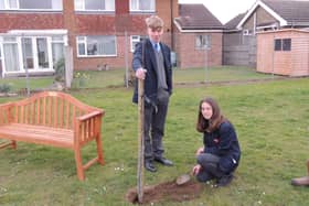 Kieran lloyd, Year 10, and Harriet Giles-Bone, Year 9, planting one of the final trees for the Arc of Remembrance at St George's Academy, Sleaford. EMN-220321-143104001