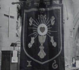 The banner showing the 5 wounds of Christ. EMN-220317-160822001