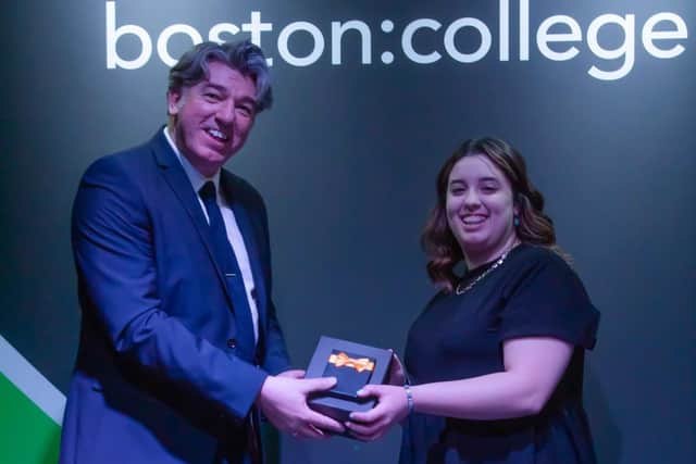 Mariana Faria is presented with her Outstanding Apprentice of the Year award from the college's Adrian Humphreys.