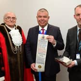 Professor Sir Jonathan Van-Tam with his Freedom of the Borough Award (centre), pictured with Boston Mayor Coun Frank Pickett and Boston Borough Council joint chief executive, Robert Barlow.