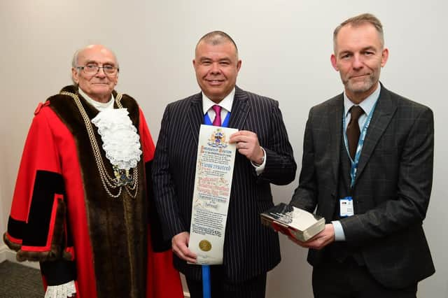 Professor Sir Jonathan Van-Tam with his Freedom of the Borough Award (centre), pictured with Boston Mayor Coun Frank Pickett and Boston Borough Council joint chief executive, Robert Barlow.