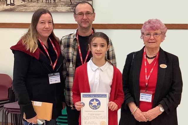 Chestnut Street Academy pupil Verity Swaby receives her Rotary Star Award at a special assembly at the school, pictured with parents Adrian and Katie Swaby and Rotary Club representative Lissie. EMN-220324-153708001