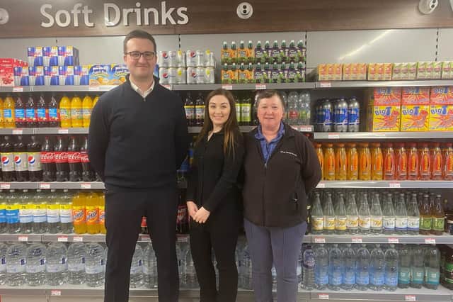 Thomas Higgins, Sarah Gillings (center) Christine Gillings on the first day under new management.