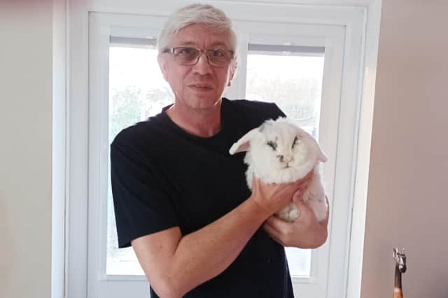 Martin with his seven year-old indoor rescue rabbit Joey.