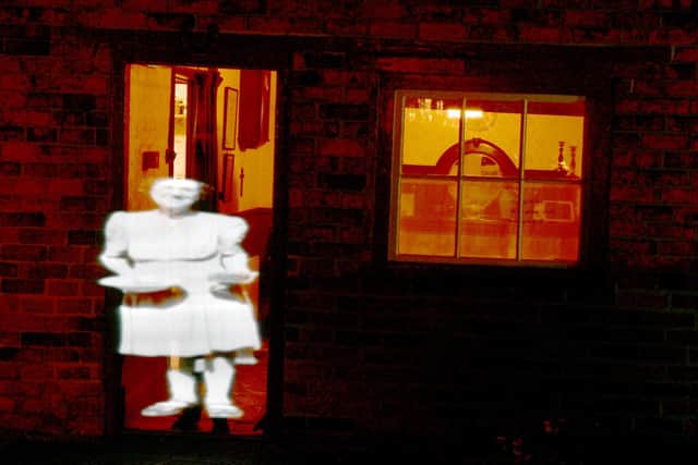 Archive image projections during Earth Hour at Mrs Smith's Cottage, Navenby.
