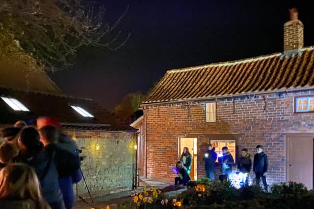 Visitors having a go at light art at Mrs Smith's Cottage in Navenby. Photo: NKDC