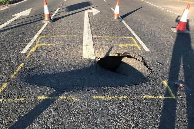 The sinkhole appeared in the A153 between Tattershall Bridge and Billinghay in April 2020. Now the repair job is to be completed over the space of 10 weeks this spring. Photo: Sleaford Police EMN-220331-164050001