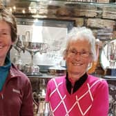 Pictured is past Captain Ruth Simpson presenting the Cheer Cup to Val Simpson (right).