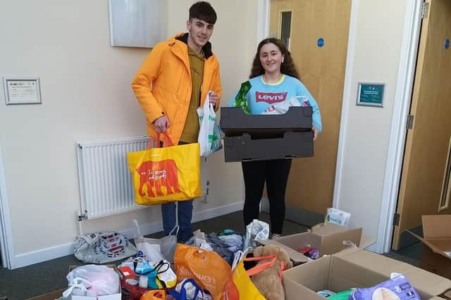 Logan and Bethan collecting more donations.