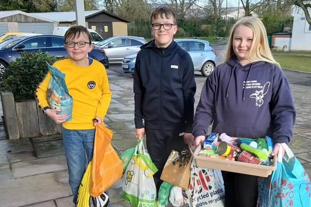 Lower school pupils with their donations.